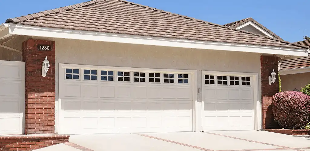 Residential garage door repair service for a double garage door in Boulder, CO