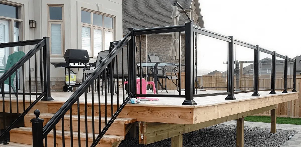 Handrail installation on a deck staircase for safety and code compliance in Boulder, CO