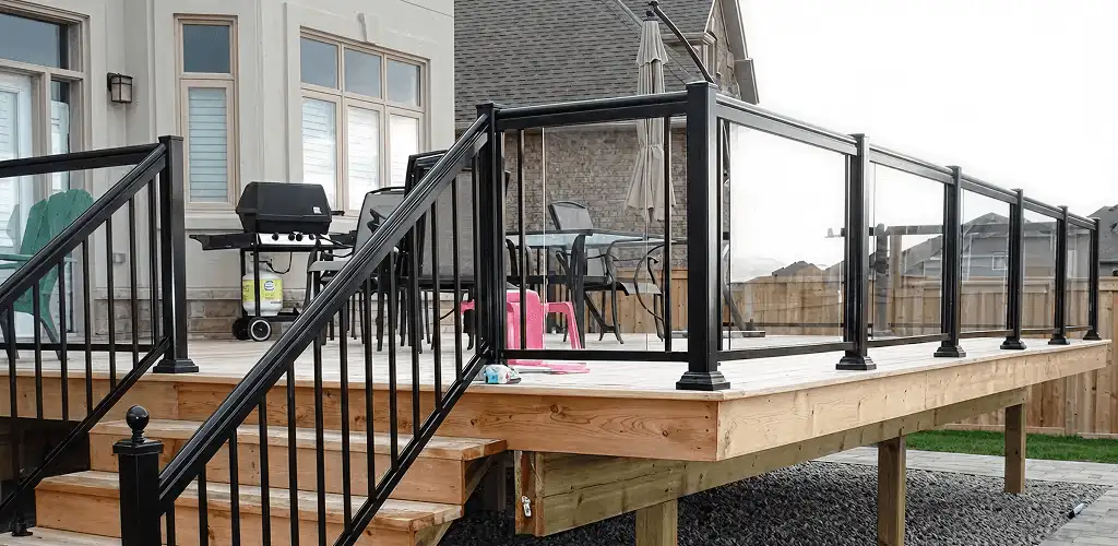 Handrail installation on a deck staircase for safety and code compliance in Boulder, CO